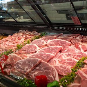 Bone-in pork chops on the Fleish Meats display counter