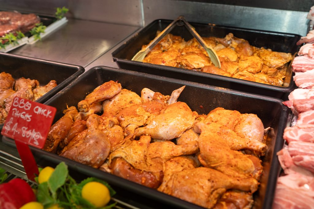 BBQ marinated chicken pieces on the grill