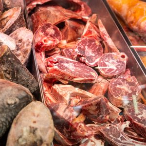 Fresh bone-in goat meat cuts on display